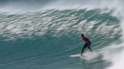 Shark swims & jumps as surfer lands perfect 20 heat total