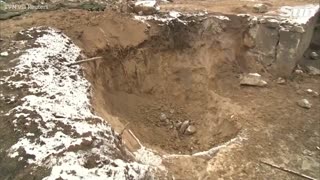 Drone footage shows crater made by missile strike on Polish border