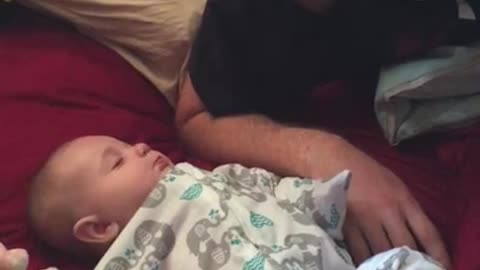 Adorable baby doesn't want to wake up
