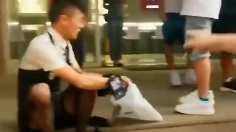 Chinese police threaten a man who's wearing a dress while live streaming on China's TikTok.