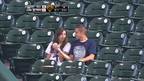 Fan makes catch to save girlfriend from foul ball