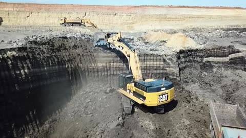 005. Excavators And Wheel Loaders Working On Huge Mining Areas - Mega Machines Movie