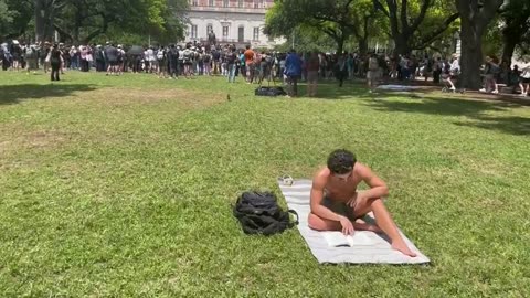 EPIC: UT Austin Student Completely Ignores Massive Anti-Israel Protest To Sunbathe