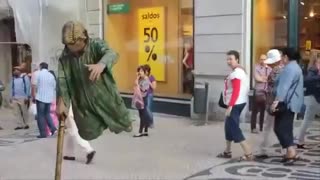 Street performer levitates for passing tourists