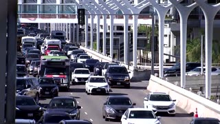 Crowds throng LAX as millions travel for Thanksgiving