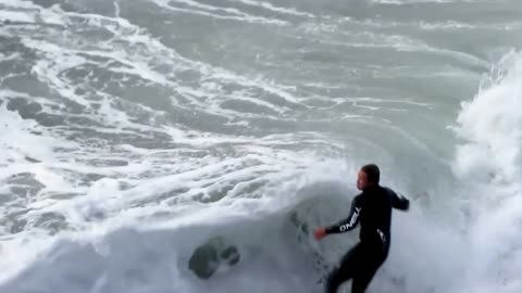 Surfers ride waves in epic slow motion