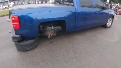 truck peeling out hits sidewalk and looses a tire