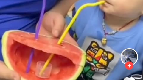 little baby enjoying watermelon juice