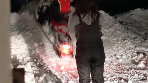 Snowmobile Kicks Snow Straight into Girlfriend