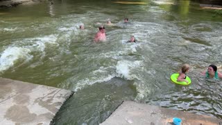 Girls Swims Through Concrete Culvert