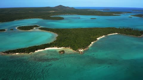 An air retreat over a tropical island near the Isle of Pines