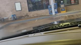 Girl Reacting to Shifter in Truck Breaking at Gas Station