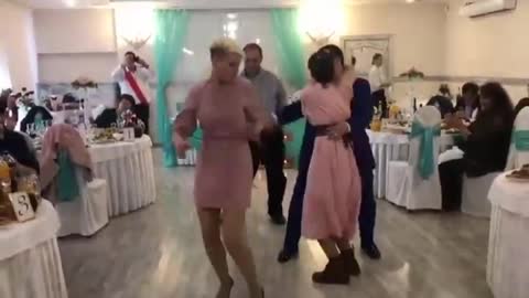 Man having funny dance with girls