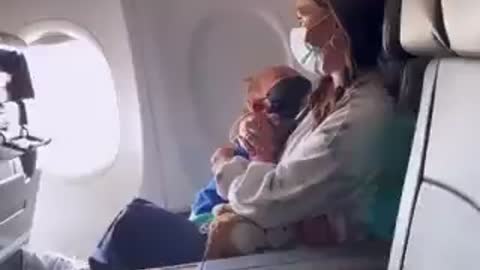 A mom and two year old who was wearing his mask improperly were kicked off an American Airlines flight.