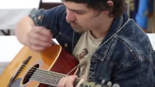 Guy makes guitar mastery seem completely effortless