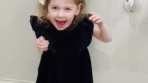 Little Girl Gets Tingling Sensation Standing Underneath The Automatic Hand Dryer