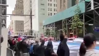 Trump supporters unveil a giant Thin Blue Line flag in front of Trump Tower