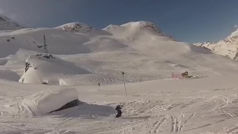 Guy skis off rock face plants into snow