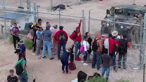 Watch Biden's Feds Unlock Private Gate to Let Migrants Into Country