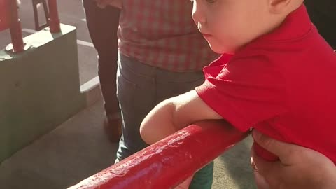 1 year old high fives fans coming into red sox stadium.