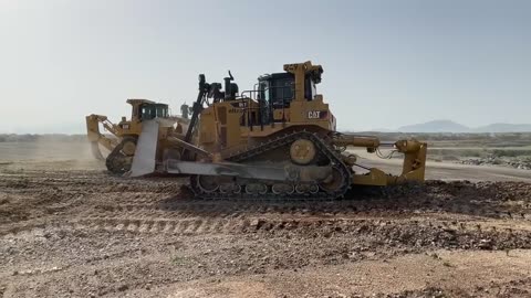 Two Caterpillar D9T Bulldozers Ripping & Pushing On Huge Mining Area