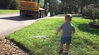 Little Boy Shouts For Joy And Wonder When The Garbage Truck Drives By