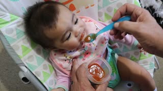 Six-Month Baby First Time eating Solid Food