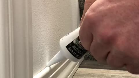 Caulking baseboard tip