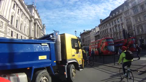 Cyclist comes inches away from collision with truck