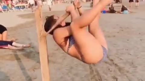 Girl fallen on the wooden pole break while doing pole yoga