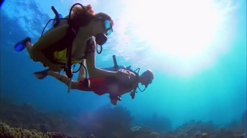 Swimming in the Ocean with partner, having enjoy