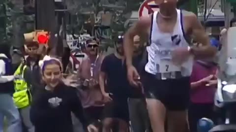 Little girl joins her father crossing the finish line