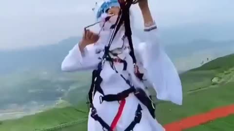 Girl flying on a parachute totally satisfying