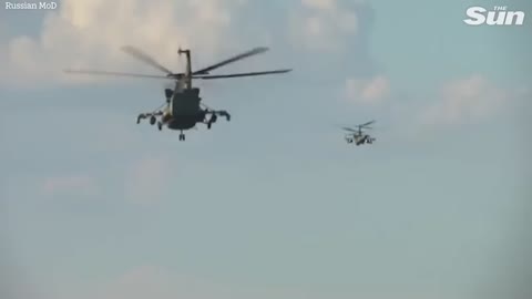 Russian Ka-52 attack helicopters fire missiles at Ukrainian strongholds