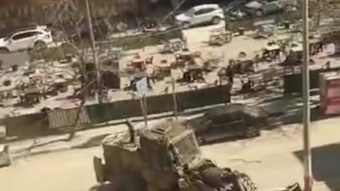 Israeli armored vehicles chasing Palestinian car