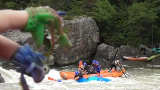 Kayaker Gets Stuck in Front of a Whitewater River Raft