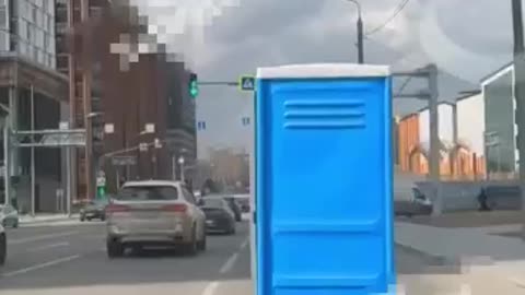 Imagine having to use a porta potty and end up dodging traffic