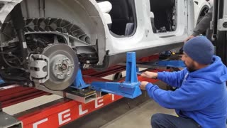Benching damaged Tesla on Celette universal jigs with side gantry