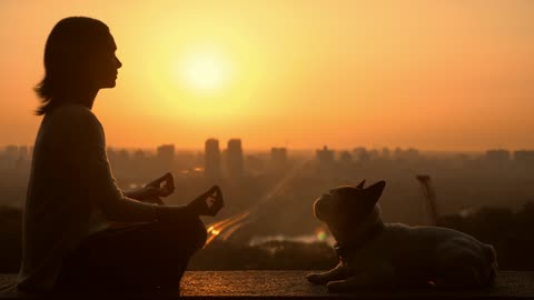 Woman meditating with her dog in the sunset 🐶🌅👩