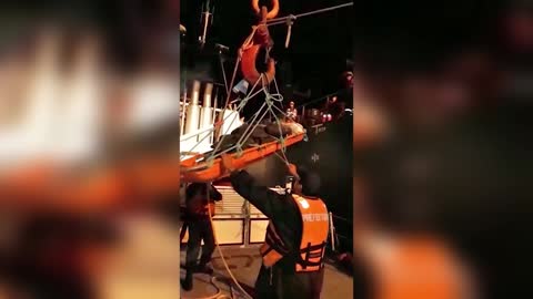 Heroic Moment Paralysed Sailor Lifted To Safety By Crane