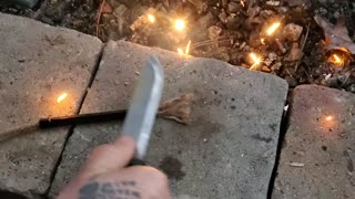 Lighting a fire wand with a ferro rod