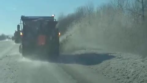 Snow plows clear the road in St. Louis