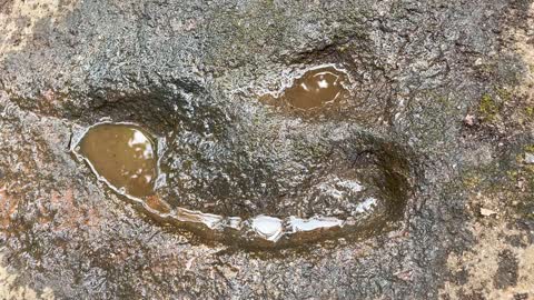 A mysterious ancient footprint in the stone mountain at Siddha Gumpha in Odisha.