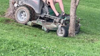 Lawnmowing Man Gets Stuck Between Trees