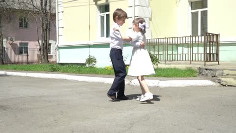 Two children dance