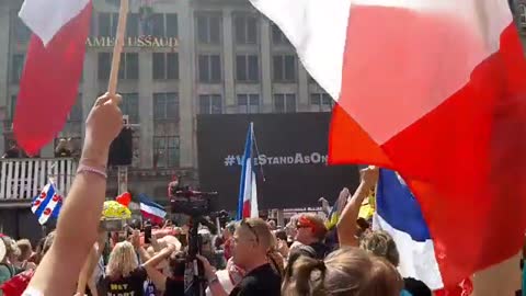 A message of support by General Flynn plays to the crowds in Amsterdam.