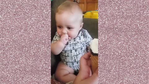 baby laughing while eating ice cream