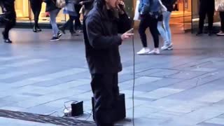 Beatboxing Busker Performs for Supine Spectator