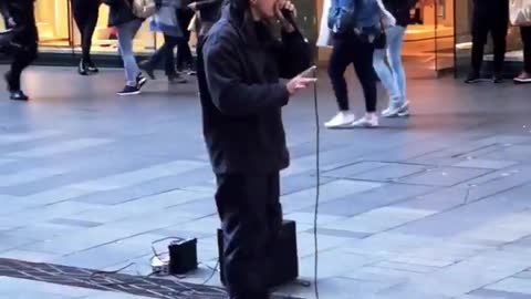 Beatboxing Busker Performs for Supine Spectator