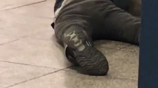 Drunk guy on the floor in a subway station